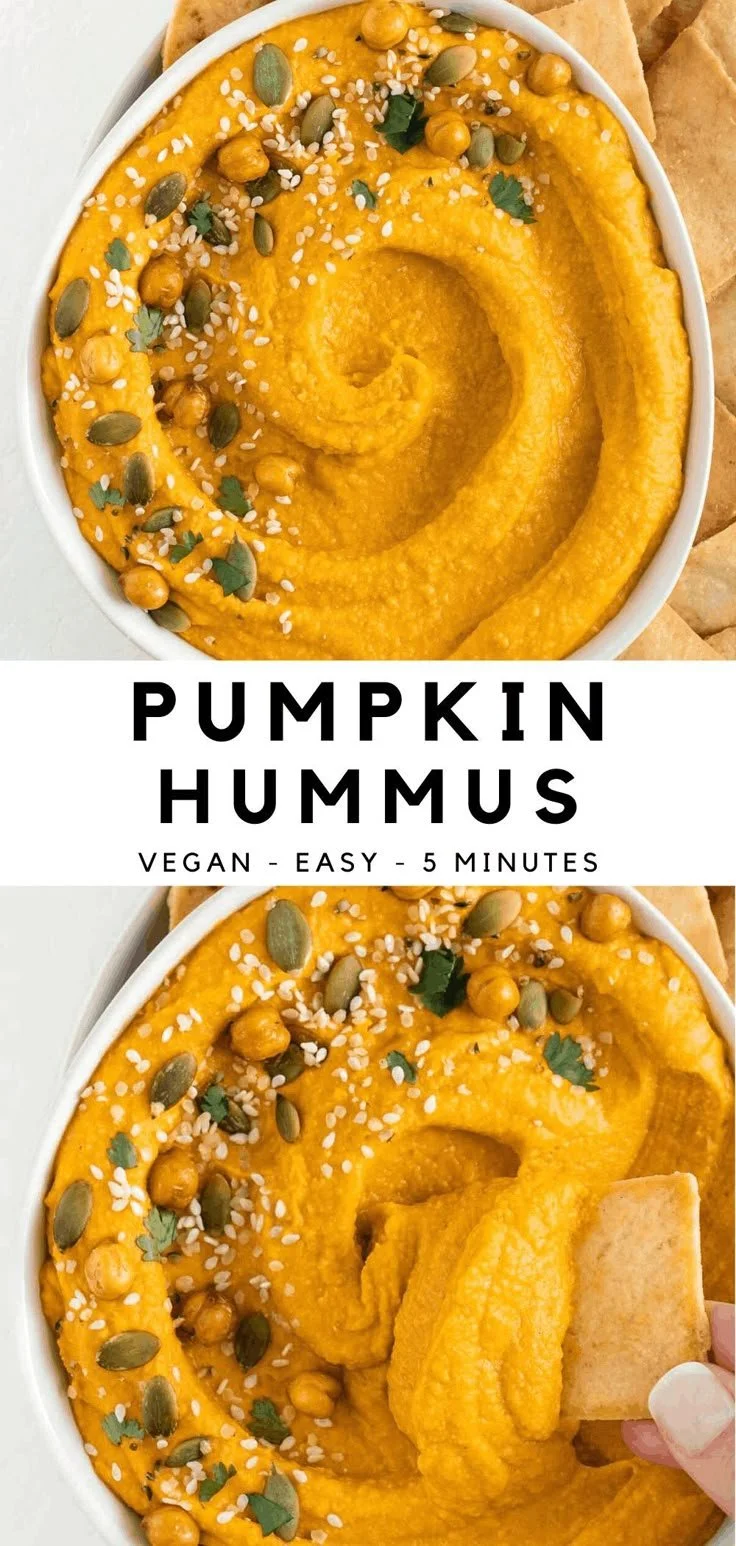 Creamy and flavorful pumpkin hummus served in a bowl with pita bread and veggies.