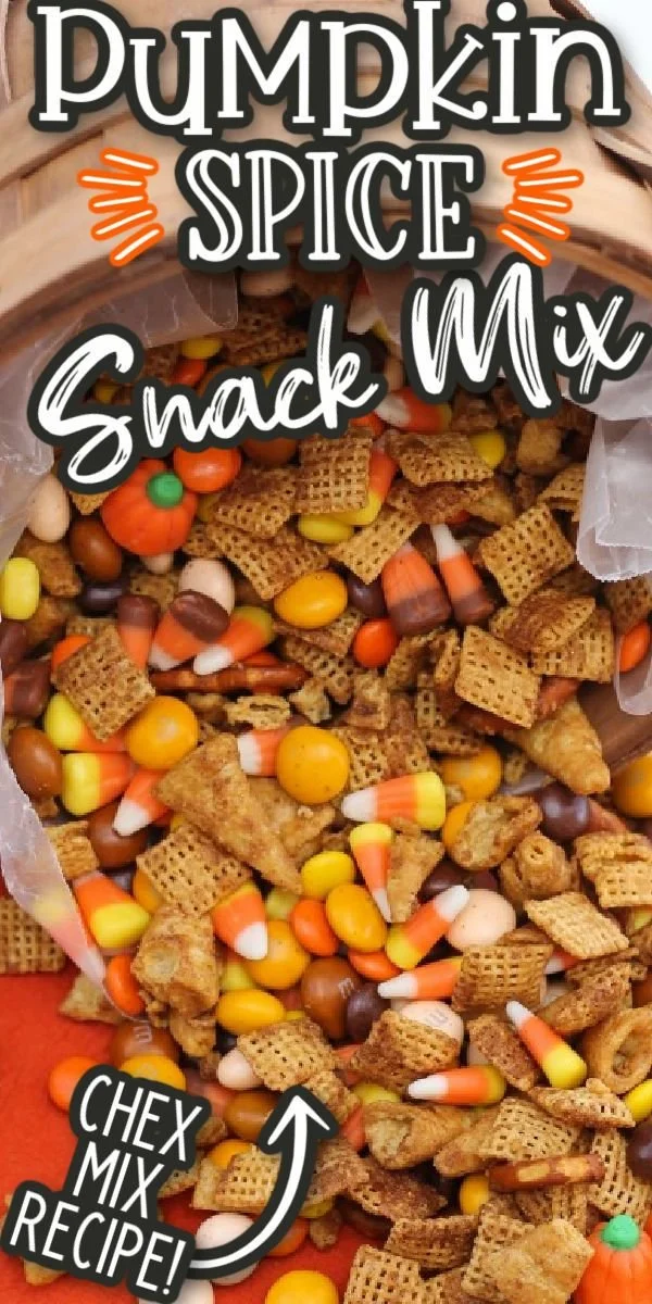Bowl of homemade Pumpkin Spice Chex Mix topped with fall spices.