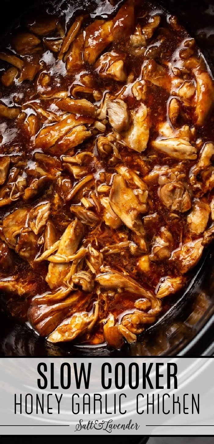 Delicious slow cooker honey garlic chicken garnished with green onions.