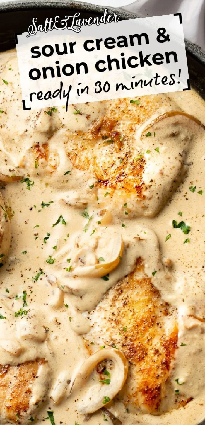 Sour cream onion chicken dish served on a plate, garnished with herbs.