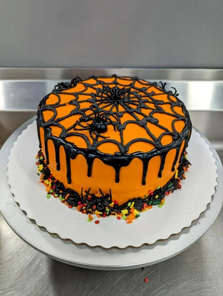 Delicious spider web cake decorated with sprinkles and chocolate icing for Halloween