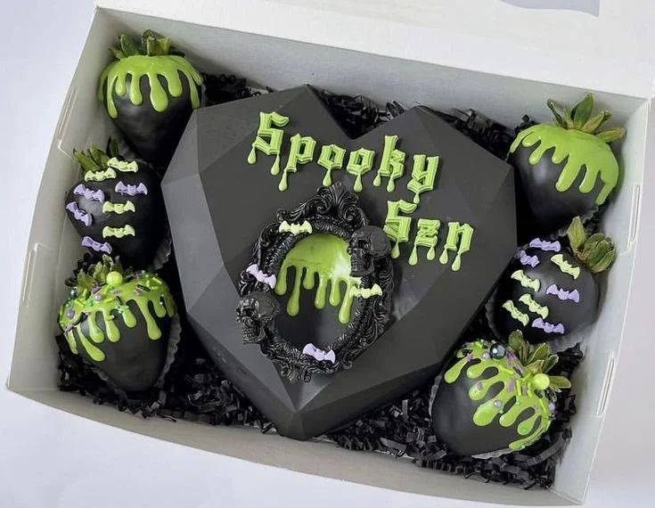 Spooky Halloween chocolate-covered strawberries featuring Frankenstein, Zombie, and Coffin designs.