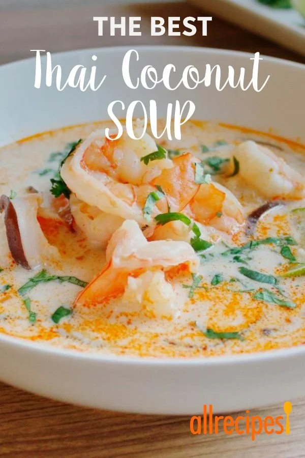 Bowl of Thai coconut shrimp soup garnished with cilantro and lime slices