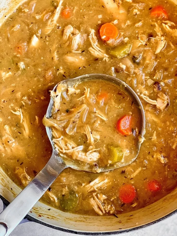 Delicious bowl of French Onion Chicken Soup topped with melted cheese and croutons.