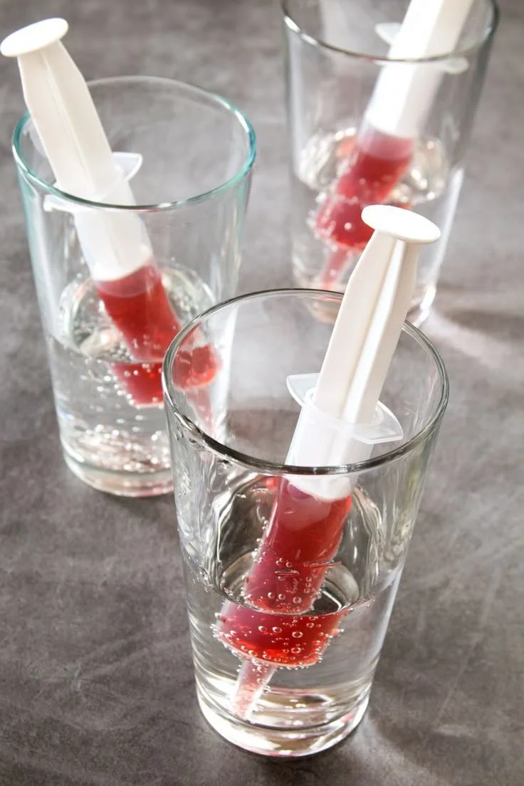 Spooky vodka cranberry syringe shot for Halloween party